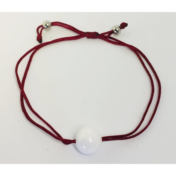 Bracelet cordons et perle en céramique