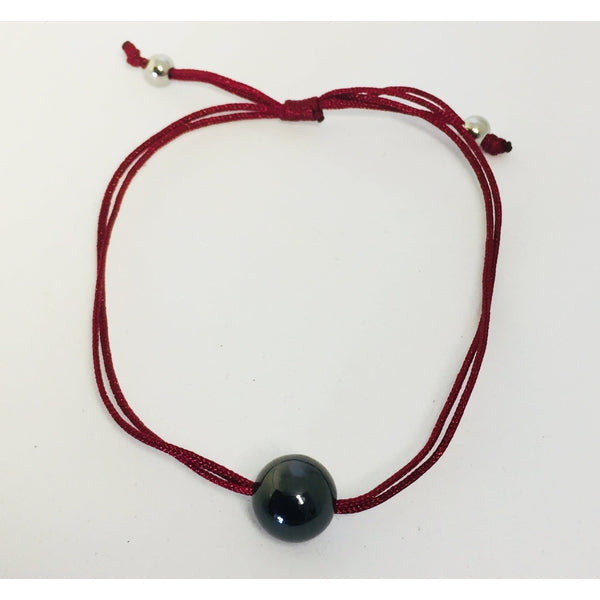 Bracelet cordons et perle en céramique